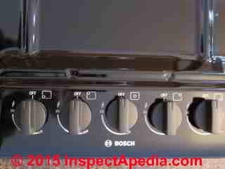 Bosch gas cooktop burner control knobs before removal (C) Daniel Friedman
