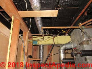Building fire damage in boiler room (C) InspectApedia.com Dovber Kahn