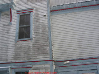 Dark stains on exterior wall, mold or algae or both (C) Daniel Friedman at Inspectapedia.com