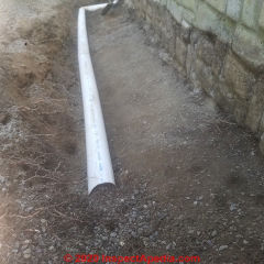 Foundation drain (French Drain) system failures traced to improper original installation, damage, clogs, broken pipes, and other  mistakes (C) InspectApedia.com Warner