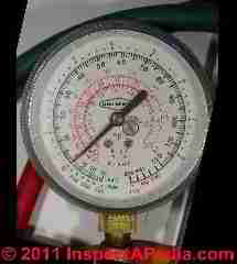 Photograph of a
commercial air conditioning compressor charging gauge set (C) InspectAPedia.com