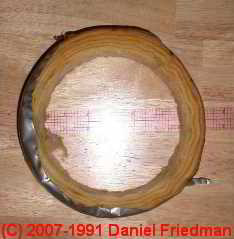 Photo of  cross section of round fiberglass duct, un-lined (C) InspectApedia.com