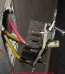 Photograph of a back wired aluminum wired electrical outlet by Roger Hankey.