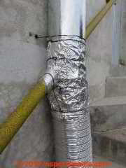 Single wall metal flue interrupted by handrailing (C) Daniel Friedman Oxaca Mexico