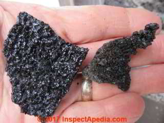 Creosote removed from a wood stove metal flue (C) Daniel Friedman at InspectApedia.com