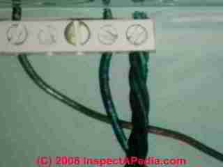 Burned ground wires in a badly wired sub panel (C) Daniel Friedman