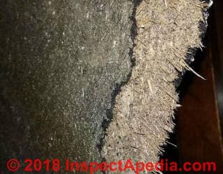 Wood fiber backed asphalt shingle siding (C) InspectApedia.com Tim
