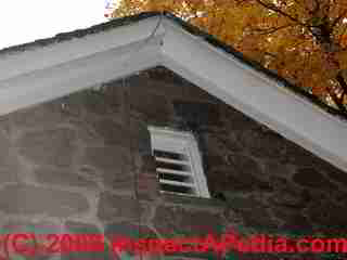 Gable end vent in a building wall - photo