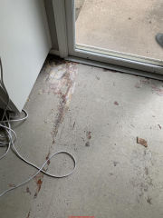 Photo of white asbestos-containing sheet flooring backer (C) InspectApedia.com reader