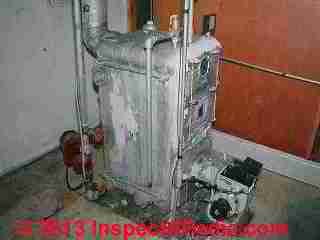 Heating boiler with most asbestos insulation removed (C) Daniel Friedman