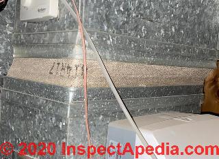 Fabric duct vibration dampener may be asbestos (C) InspectApedia.com Mimi