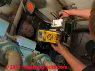 Cad cell check during heating system tuneup © D Friedman at InspectApedia.com 