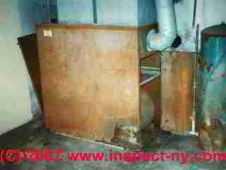 Photograph of a badly rusted furnace