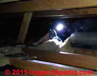 Vacuum removal of attic insulation (C) InspectApedia.com excerpt from YouTube Video