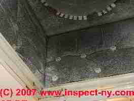 Photograph of paint overspray and house dust on a heating return plenum