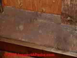 Dark stains on rafters in an attic - is this mold? (C) 2013 InspectAPedia