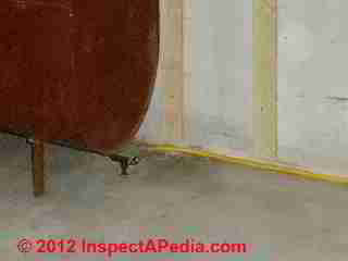 Flexible copper oil piping new installation, protected © D Friedman at InspectApedia.com 