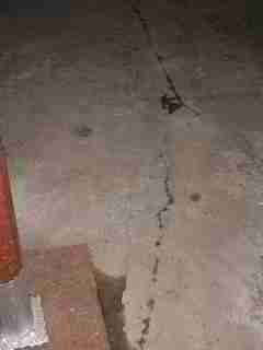 Evidence of oil pipes below a concrete basement floor (C) Daniel Friedman