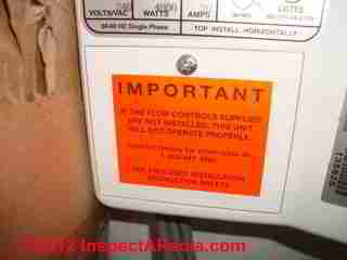Flow control valve warning for tankless water heater © D Friedman at InspectApedia.com 
