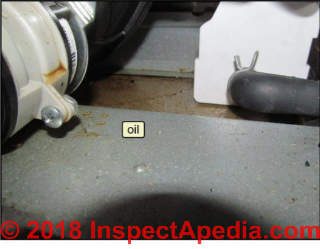 Oil leak at gas furnace (C) InspectApedia.com HendersonR