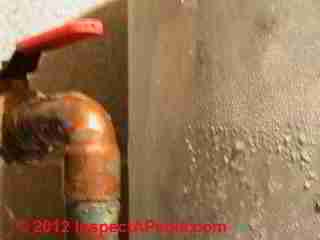Condensation on a water pressure tank © D Friedman at InspectApedia.com 