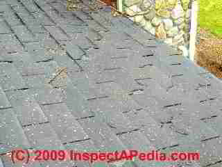 Cracked broken roof shingles (C) Daniel Friedman