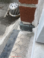 roof drain debris and broken ring (C) InspectApedia.com Anon