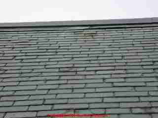 Snow guards or hooks on slate roof