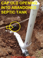 Old septic tank entry port is capped off (C) InspectApedia.com A Church