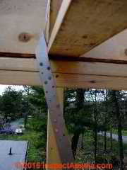 Framing connector between roof I-joist and stud wall © Daniel Friedman at InspectApedia.com