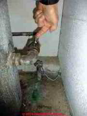 Snifter valve on a submersible pump well system © D Friedman at InspectApedia.com 