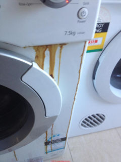 Oil leak at the front of a Samsung Silver Nano front loader clothes washing machine (C) InspectApedia.com Eduardo