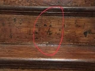 Carpenter's mark or intiials on stair riser in an older home (C) Inspectapedia.com Stephans