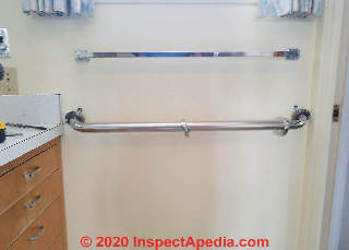 Grab bar length is longest that fits in the space when the recommended 42-inch length (ADA) is not available (C) Daniel Friedman at InspectApedia.com
