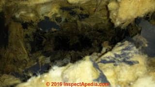 Fiberglass-lined HVAC ducts badly damaged by mechanical duct cleaning (C) InspectAPedia.com