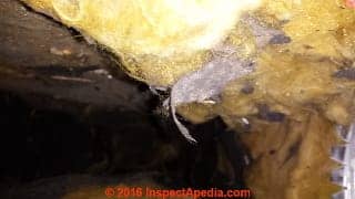 Fiberglass-lined HVAC ducts badly damaged by mechanical duct cleaning (C) InspectAPedia.com