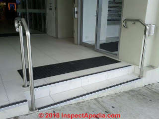 Steps landing on an un-even surface are permitted by code but require special color coding to reduce fall hazards. (C) InspectApedia.com