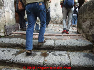 Walkers ascending a low-rise stone stairway in Tlaxcala, Mexico (C) Daniel Friedman at InspectApedia.com