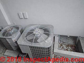 AC compressors close together and close to a wall may suffer a shorter life and become noisy (C) InspectApedia.com reader