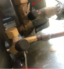 Icing on suction line at refrigerant piping - no insulation, check charge (C) InspectApedia.com ChenJ