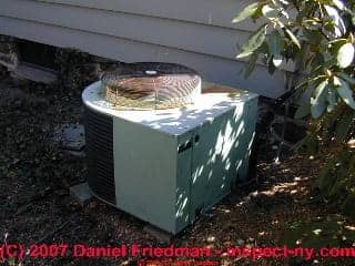 Photograph of a burned out old air conditioning compressor condenser unit
