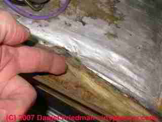 Moldy insulation in an air conditioner air handler unit on fiberglass insulation (C) Daniel Friedman
