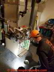 Cleaning the blower assembly of an air handler unit  (C) Daniel Friedman James Agzigian