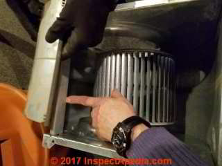 Cleaning the blower assembly of an air handler unit  (C) Daniel Friedman James Agzigian