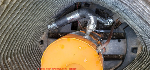 Insulation on suction line & on compressor motor (C) InspetApedia.com Gergen