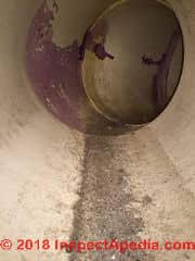 Dirt and water in plastic in-slab duct in a Minnesota home (C) Inspectapedia.com Reader N.