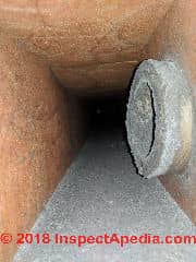 Gray dust deposits on fiberglass ductwork surfaces can't be cleaned (C) InspectApedia.com Luke