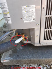 Frost on the suction line at the compressor/condenser unit of a new system (C) InspectApedia.com Ryan