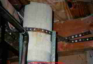 Photograph of  asbestos paper wrap on heating/cooling duct exterior