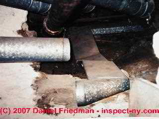 Photograph of disconnected air conditioning duct in a crawl space